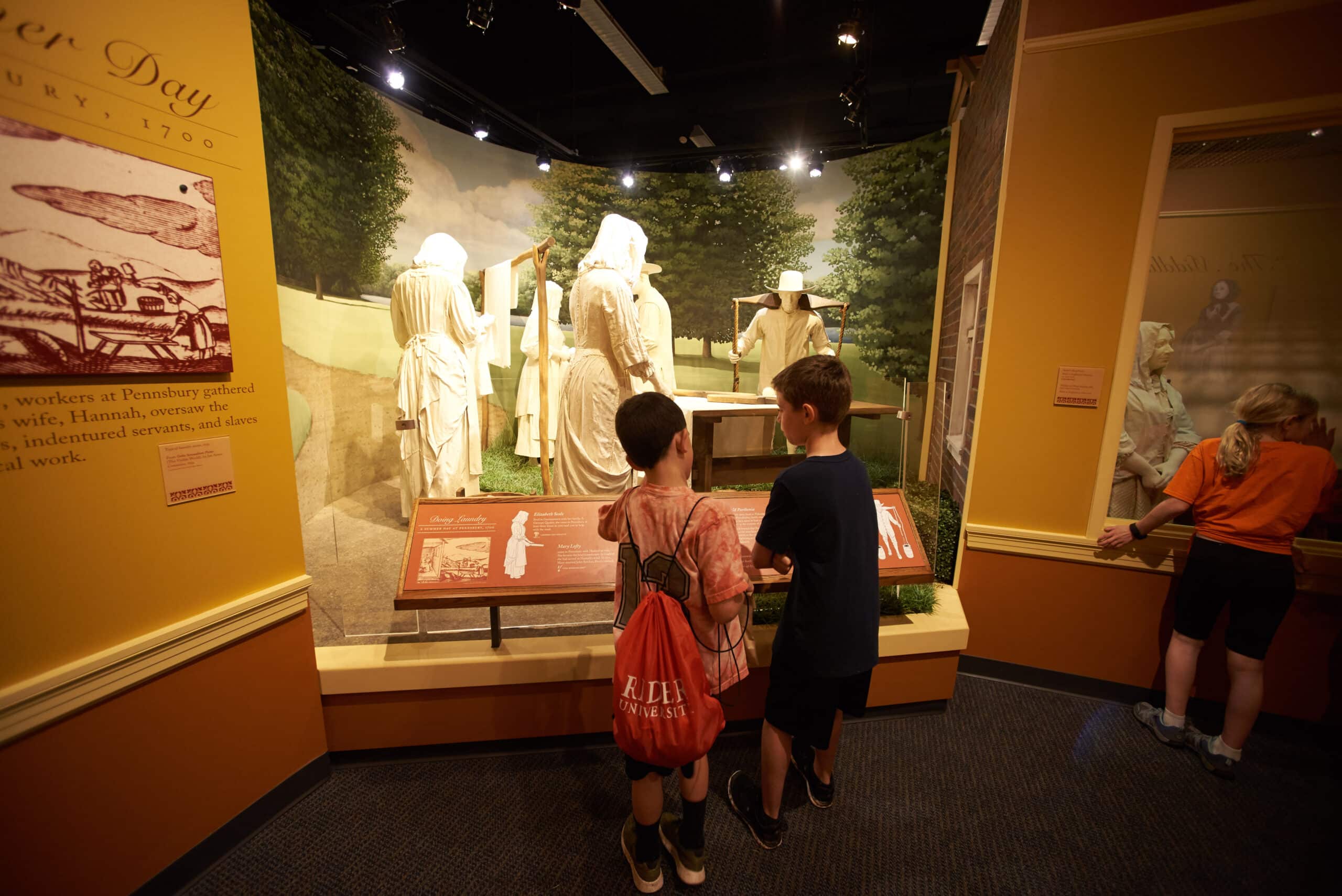 Students inside our Seed of a Nation exhibit learn about indentured servants